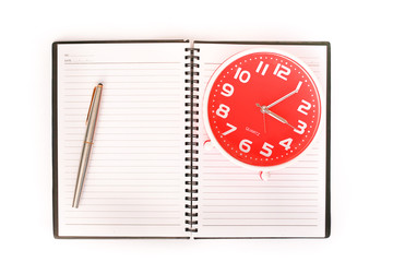 Fototapeta na wymiar Clock and notebook on white background
