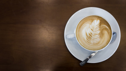 Hot art Latte Coffee in the table