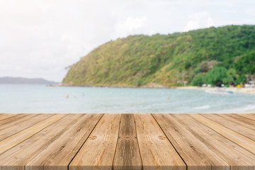 Fototapeta premium Vintage wooden board empty table in front of blue sea & sky background. Perspective wood floor over sea and sky - can be used for display or montage your products. beach & summer concepts.