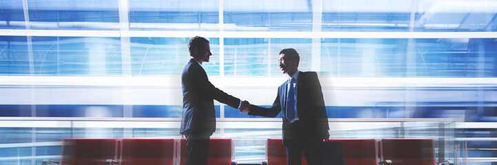 Businessmen Talking Business in the Airport Concept © Rawpixel.com