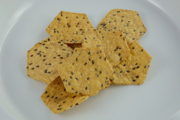 Multigrain tortilla chips in bowl made with brown rice, flax, sesame seeds, sunflower seeds and quinoa