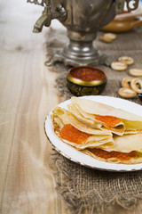 Pancakes with caviar on the table