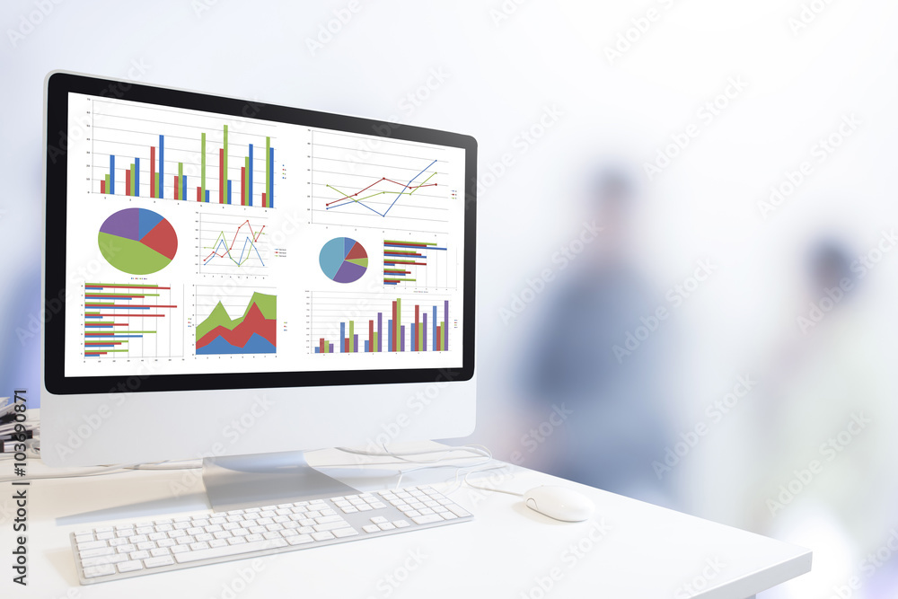 Poster Modern computer with keyboard and mouse on table showing charts