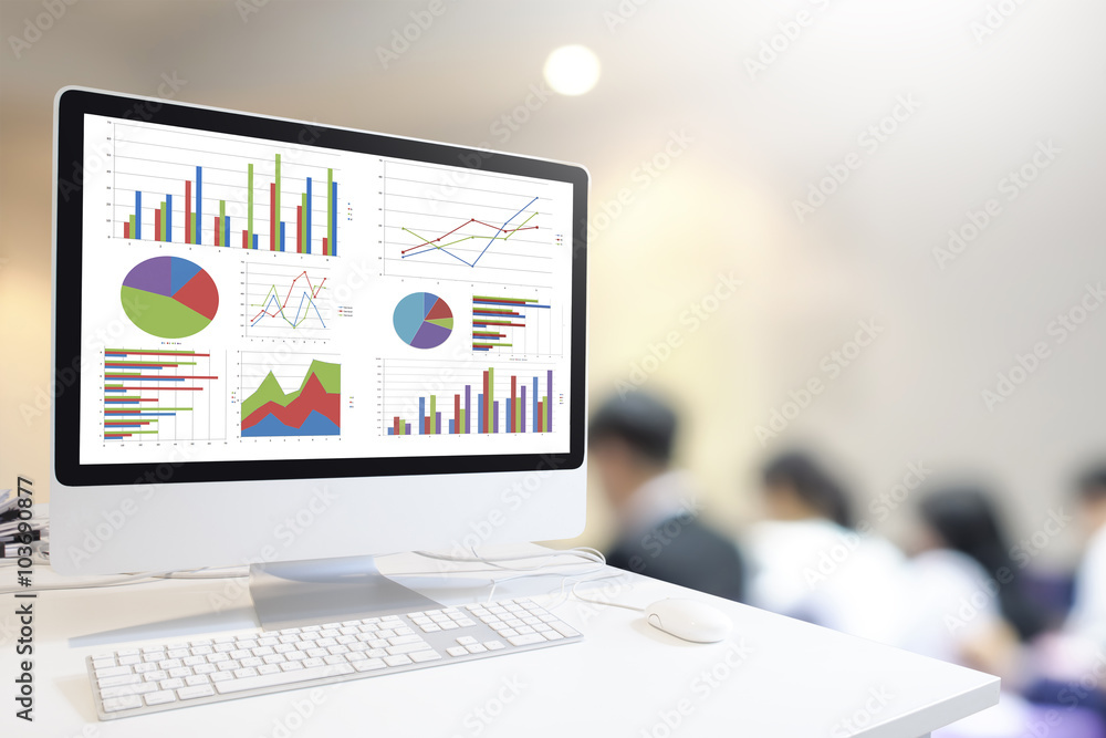 Poster Modern computer with keyboard and mouse on table showing charts