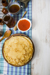 Pancakes with red caviar on a table