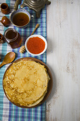 Pancakes with red caviar on a table