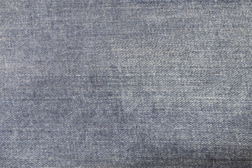 Texture of blue jeans textile close up