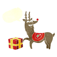 retro speech bubble cartoon christmas reindeer with present