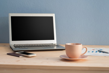 Office table with Coffee cup and Office equipment.