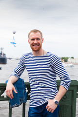 Fototapeta na wymiar man sailor at waterfront in St. Petersburg