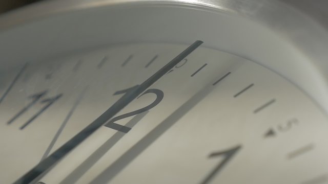 Slow motion time passing on analog clock shallow DOF 1080p HD footage - Shallow DOF clock-face needles moving 1920X1080 FullHD video
