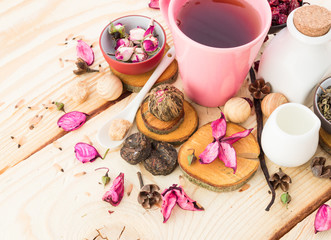 Fototapeta na wymiar Tea cups with teapot on old wooden table