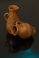 Beautiful decorative clay pots brown on a black background