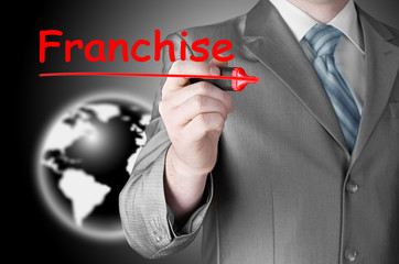 business man writing franchise