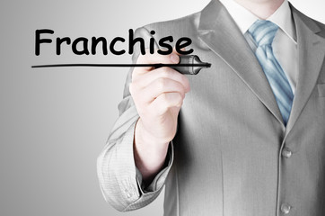 business man writing franchise