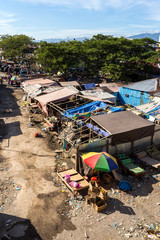 poor houses by the river in shantytown