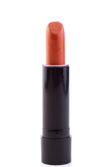 Obraz premium Orange lipstick isolated on a white background