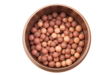 Beige cosmetics rouge balls, bronzing pearls. Isolated