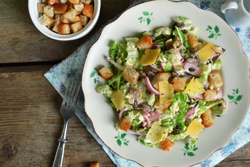 Chinese cabbage salad with croutons, cheese and delicate sauce