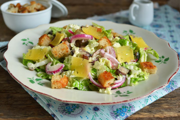 Chinese cabbage salad with croutons, cheese and delicate sauce