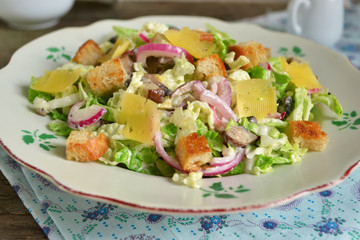 Chinese cabbage salad with croutons, cheese and delicate sauce
