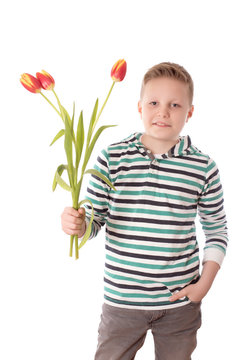 Young boy with tulips isolated on white background