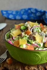 Chinese cabbage salad with croutons, cheese and delicate sauce