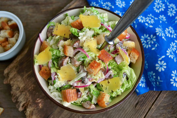 Chinese cabbage salad with croutons, cheese and delicate sauce