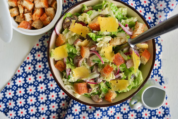 Chinese cabbage salad with croutons, cheese and delicate sauce