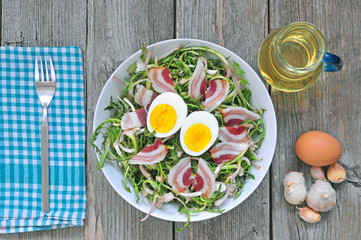 Dandelion salad with eggs and bacon