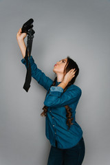 Portrait of cute teen girl making pictures to herself isolated on gray and studio background posing to the camera