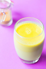Turmeric with Coconut Milk Drinks and Ghee on Pink Background Good for Beauty and Health, Gives a lot of Energy, Close-up