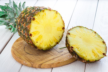 Fresh Pineapple on Light White Wooden Background, Close-up
