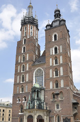 Fototapeta premium St. Mary's Church built in brick gothic style in the Main Market Square in Krakow, Poland