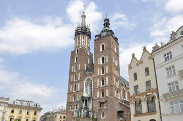 Fototapeta na wymiar St. Mary's Church built in brick gothic style in the Main Market Square in Krakow, Poland