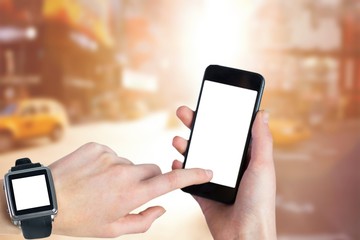 Composite image of woman using smartwatch and phone