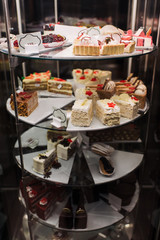 Pastry shop display window with variety of cake