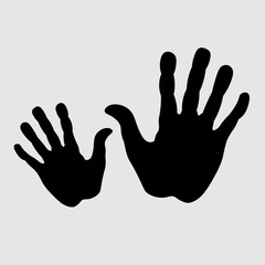 Obraz premium Two hands on black Two hands in black on a white background a children's hand another adult for design and decoration 
