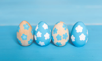 Easter background. Painted eggs on blue background