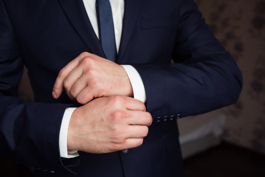 Mans hands with cufflinks. Elegant gentleman clother