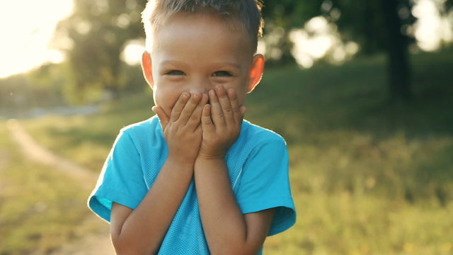 Portrait of smiling boy on sunset