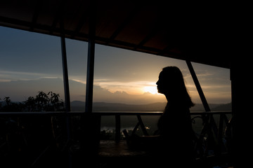 Fototapeta premium Silhouette of the woman standing to thinking