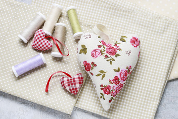 Sewing set: fabrics, threads and handmade hearts