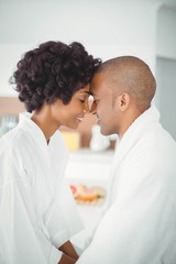 Happy couple hugging in the kitchen