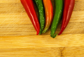 Many vibrant colors on peppers on the board