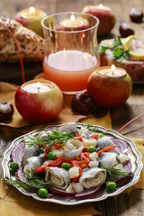 Pickled herring rolls with vegetables