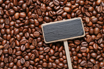 Coffee beans on wooden background