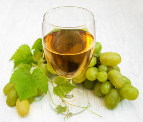 Glass with wine and white grape