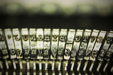 Hammer keys on an old type writer. Vintage filter.