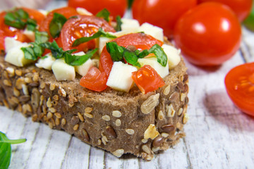 Ciabatta bread with tomatoes, mozzarella and basil.